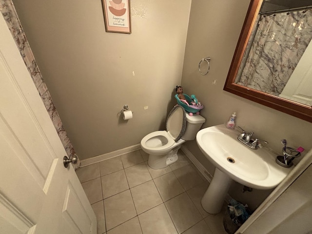 14813 Kilpatrick Ave, Midlothian, IL 60445 - full bath featuring toilet and tile patterned floors