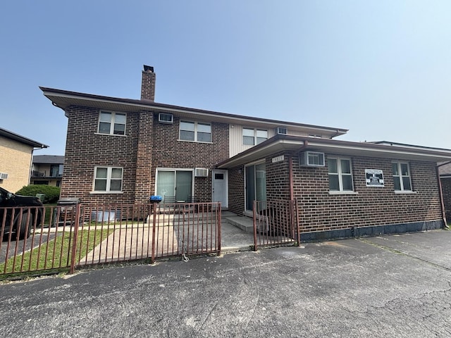 14813 Kilpatrick Ave, Midlothian, IL 60445 - view of front of property featuring brick siding, a chimney, and a patio area