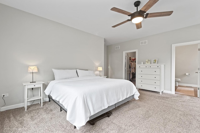 25313 W Rock Dr, Plainfield, IL 60586 - carpeted bedroom featuring a walk in closet, connected bathroom, a ceiling fan, and a closet