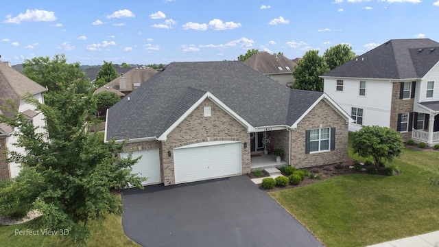 25313 W Rock Dr, Plainfield, IL 60586 - view of front of property featuring an attached garage, a residential view, driveway, a front lawn, and brick siding