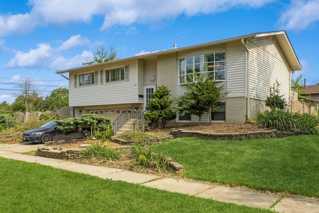 14772 Menard Ave, Oak Forest, IL 60452 - split foyer home featuring a front yard and an attached garage