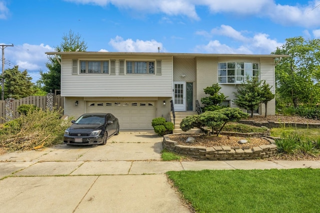 14772 Menard Ave, Oak Forest, IL 60452 - raised ranch featuring concrete driveway, a garage, and brick siding