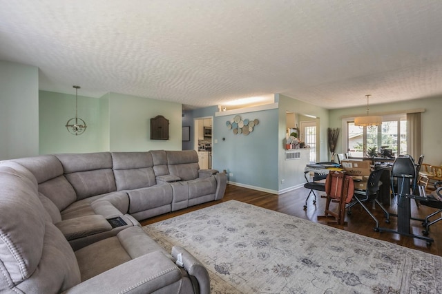 14772 Menard Ave, Oak Forest, IL 60452 - living area with dark wood finished floors and a textured ceiling