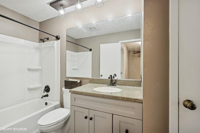 82 Hickory Ln, Cary, IL 60013 - bathroom with vanity, shower / bathtub combination, and a textured ceiling