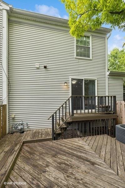 82 Hickory Ln, Cary, IL 60013 - rear view of house featuring a wooden deck