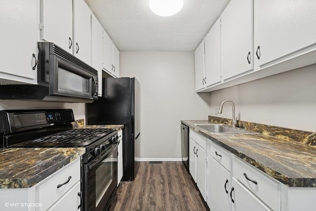 82 Hickory Ln, Cary, IL 60013 - kitchen with black appliances, dark wood-type flooring, dark countertops, and white cabinetry
