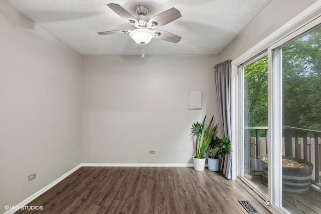 82 Hickory Ln, Cary, IL 60013 - empty room with wood finished floors, a ceiling fan, and a textured ceiling