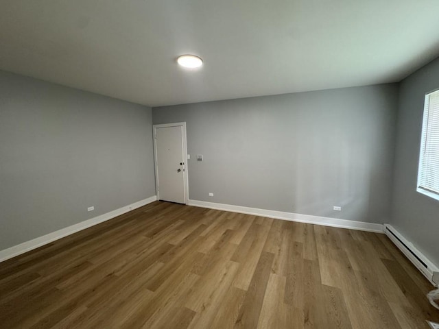 316 Marengo Ave Unit 3C, Forest Park, IL 60130 - unfurnished room featuring baseboard heating and wood finished floors