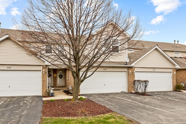 18283 Kirby Dr, Tinley Park, IL 60487 - traditional home with brick siding, a shingled roof, and driveway