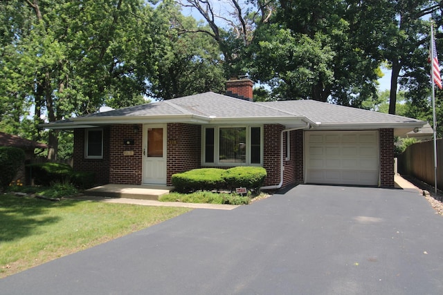 328 Dwight Ave, Joliet, IL 60436 - ranch-style home with an attached garage, driveway, brick siding, a chimney, and a shingled roof