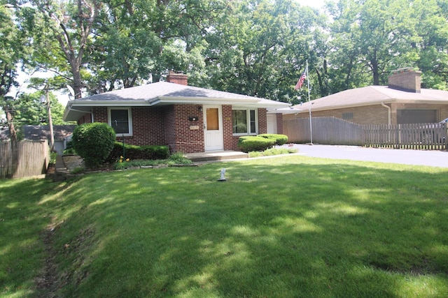 328 Dwight Ave, Joliet, IL 60436 - ranch-style house with brick siding and a chimney