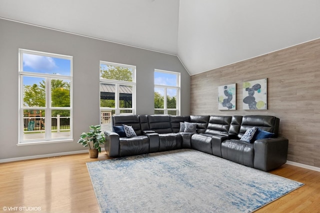 527 Capital Ln, Gurnee, IL 60031 - living room featuring wood finished floors, high vaulted ceiling, and an accent wall