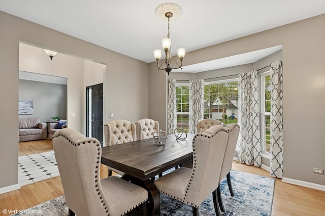 527 Capital Ln, Gurnee, IL 60031 - dining room with light wood-style floors and a chandelier