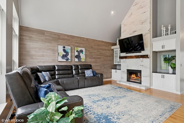 527 Capital Ln, Gurnee, IL 60031 - living area with high vaulted ceiling, a fireplace, and wood finished floors