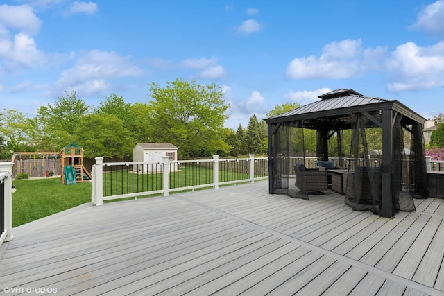 527 Capital Ln, Gurnee, IL 60031 - wooden deck with a gazebo, a storage unit, a playground, a fenced backyard, and outdoor lounge area
