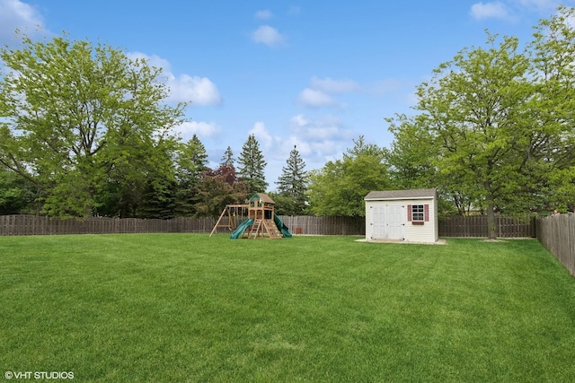 527 Capital Ln, Gurnee, IL 60031 - fenced backyard with a playground and a storage shed