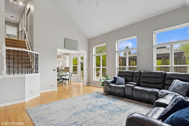 527 Capital Ln, Gurnee, IL 60031 - living area with high vaulted ceiling, wood finished floors, stairway, and a ceiling fan