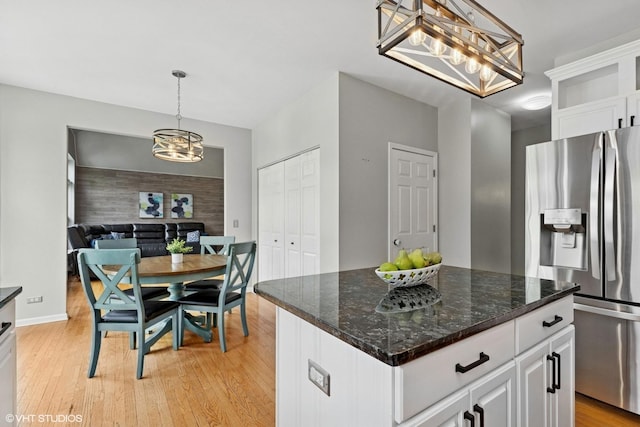 527 Capital Ln, Gurnee, IL 60031 - kitchen with stainless steel fridge, a chandelier, white cabinetry, and light wood-style flooring