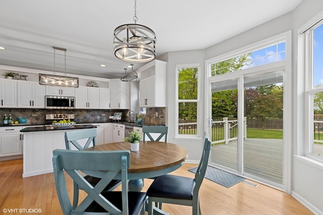 527 Capital Ln, Gurnee, IL 60031 - dining room with light wood finished floors, a chandelier, and recessed lighting