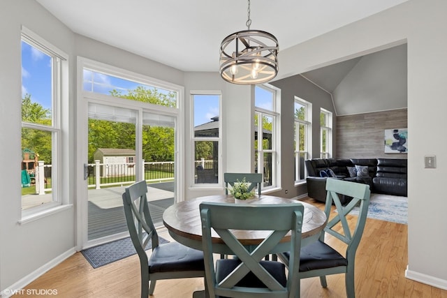 527 Capital Ln, Gurnee, IL 60031 - dining area with a chandelier, light wood-type flooring, and vaulted ceiling