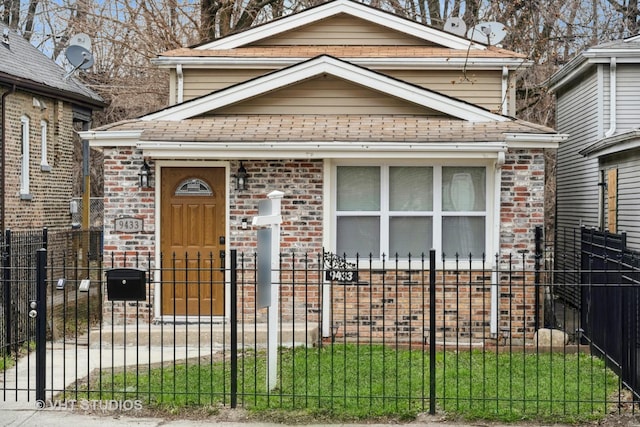 9433 S Burnside Ave, Chicago, IL 60619 - view of front of home featuring a fenced front yard, brick siding, and a gate
