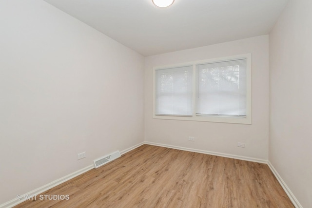 9433 S Burnside Ave, Chicago, IL 60619 - unfurnished room with light wood-style flooring and baseboards