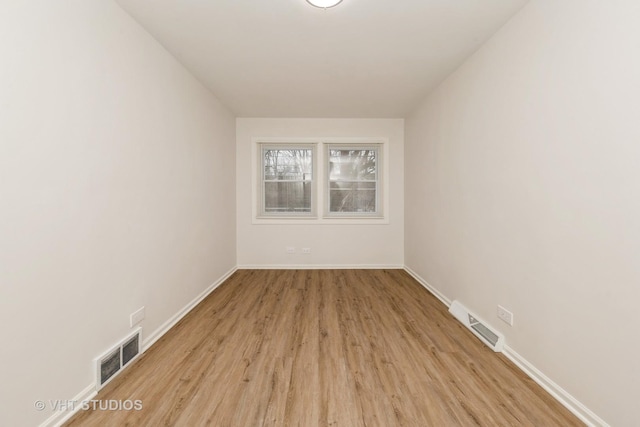 9433 S Burnside Ave, Chicago, IL 60619 - empty room with light wood-type flooring and baseboards