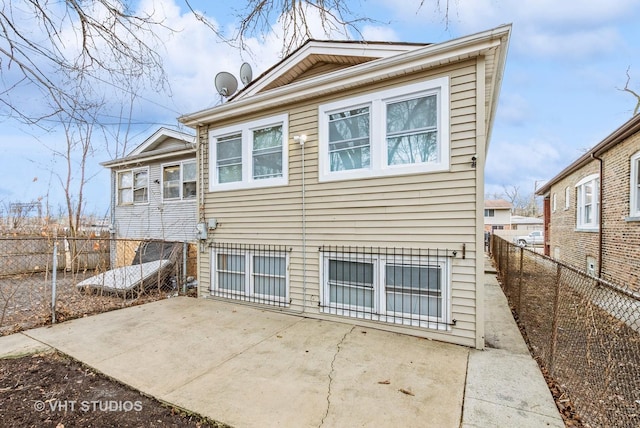 9433 S Burnside Ave, Chicago, IL 60619 - rear view of property featuring a patio area and a fenced backyard