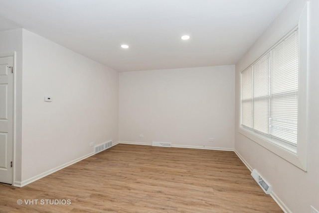 9433 S Burnside Ave, Chicago, IL 60619 - empty room with light wood-style floors and recessed lighting