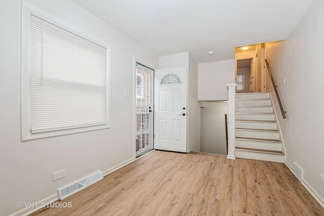 9433 S Burnside Ave, Chicago, IL 60619 - entrance foyer featuring light wood finished floors and stairway