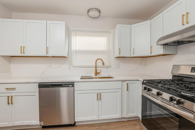 9433 S Burnside Ave, Chicago, IL 60619 - kitchen with appliances with stainless steel finishes, under cabinet range hood, white cabinetry, and light countertops