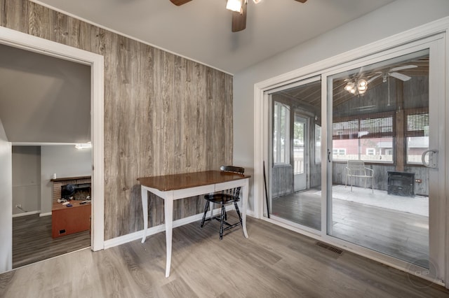 3917 Jonathan Simpson Dr, Joliet, IL 60431 - office area featuring a ceiling fan, wood finished floors, and wooden walls
