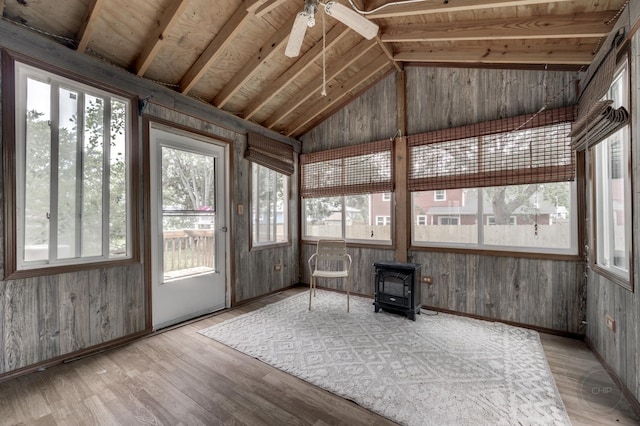 3917 Jonathan Simpson Dr, Joliet, IL 60431 - unfurnished sunroom with a wood stove, plenty of natural light, vaulted ceiling, wood finished floors, and wooden walls
