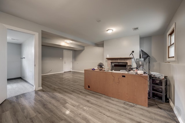 3917 Jonathan Simpson Dr, Joliet, IL 60431 - home office with a fireplace and light wood-style flooring
