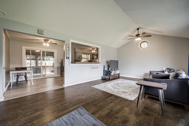 3917 Jonathan Simpson Dr, Joliet, IL 60431 - living room featuring ceiling fan, vaulted ceiling, wood finished floors, and a textured ceiling