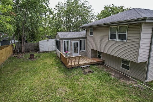 3917 Jonathan Simpson Dr, Joliet, IL 60431 - rear view of property featuring a deck, a shingled roof, and a storage shed