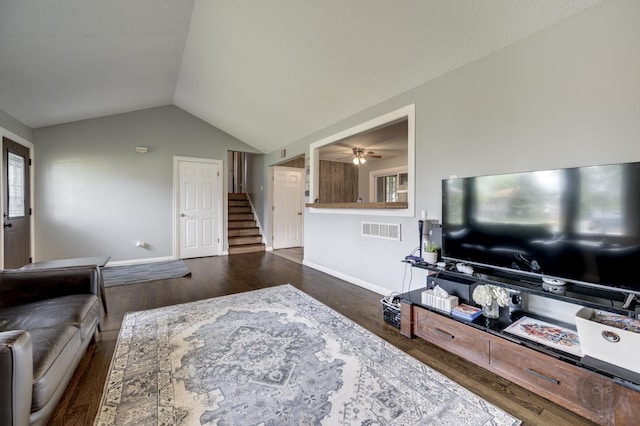 3917 Jonathan Simpson Dr, Joliet, IL 60431 - living room featuring wood finished floors, stairway, vaulted ceiling, and a ceiling fan