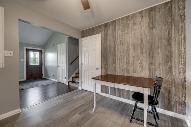 3917 Jonathan Simpson Dr, Joliet, IL 60431 - entrance foyer featuring stairs, wood walls, ceiling fan, wood finished floors, and lofted ceiling