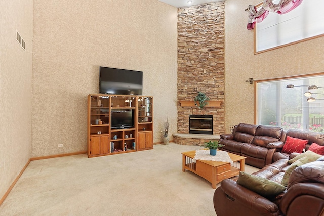 2708 High Meadow Rd, Naperville, IL 60564 - carpeted living room with a high ceiling and a stone fireplace