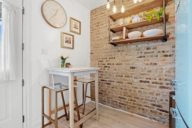4006 W Wellington Ave Unit 3, Chicago, IL 60641 - bar featuring light wood-style floors and brick wall