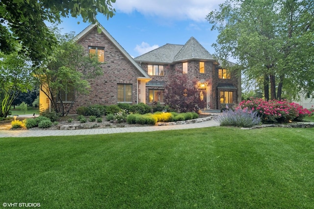 22902 W Lochanora Dr, Hawthorn Woods, IL 60047 - view of front of house with brick siding, a front lawn, and a high end roof