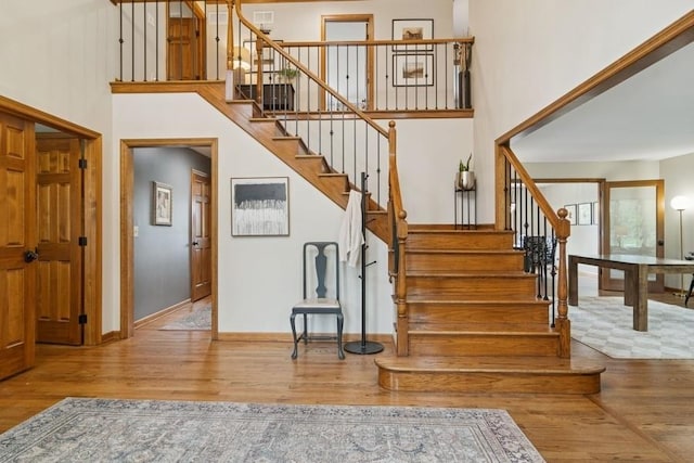 22902 W Lochanora Dr, Hawthorn Woods, IL 60047 - stairway with a towering ceiling and wood finished floors