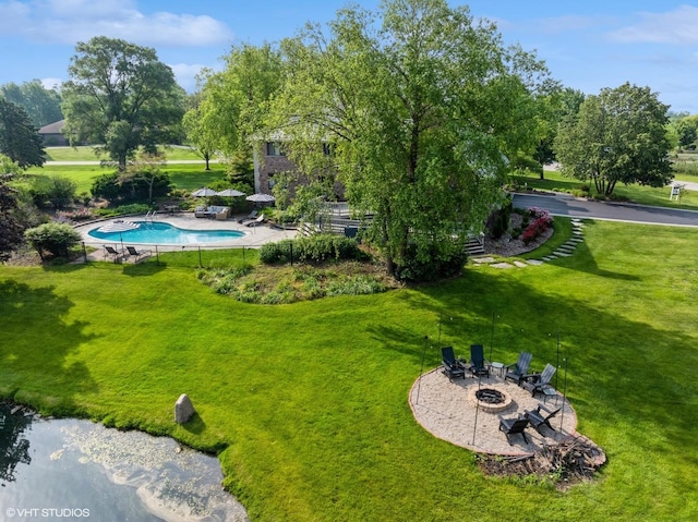 22902 W Lochanora Dr, Hawthorn Woods, IL 60047 - view of green lawn featuring a fire pit, an outdoor pool, and a patio area