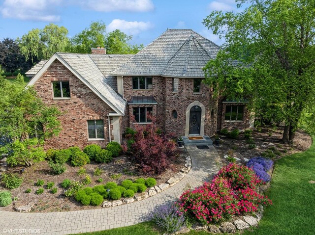 22902 W Lochanora Dr, Hawthorn Woods, IL 60047 - view of front of house with a chimney, a high end roof, and brick siding