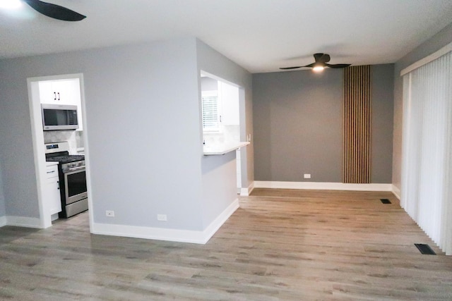 369 Ferndale Ct Unit B1, Schaumburg, IL 60193 - spare room featuring a ceiling fan and light wood finished floors
