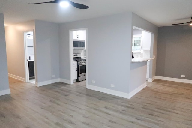 369 Ferndale Ct Unit B1, Schaumburg, IL 60193 - empty room with ceiling fan and light wood-style flooring