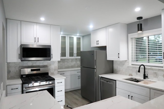 369 Ferndale Ct Unit B1, Schaumburg, IL 60193 - kitchen with appliances with stainless steel finishes, light stone countertops, tasteful backsplash, white cabinets, and recessed lighting