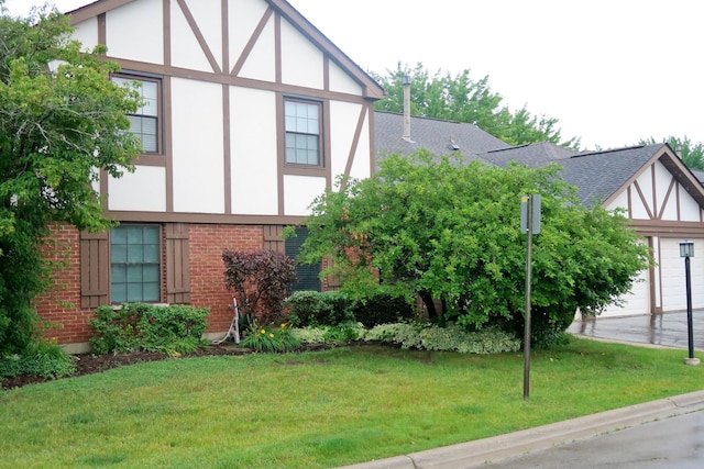 369 Ferndale Ct Unit B1, Schaumburg, IL 60193 - view of property exterior with brick siding, stucco siding, a lawn, and a shingled roof