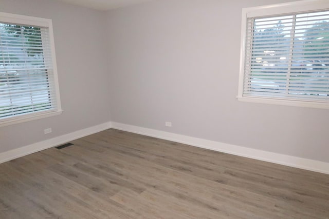 369 Ferndale Ct Unit B1, Schaumburg, IL 60193 - spare room featuring wood finished floors and baseboards