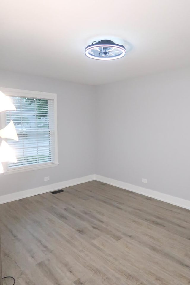 369 Ferndale Ct Unit B1, Schaumburg, IL 60193 - empty room with light wood-style flooring and baseboards